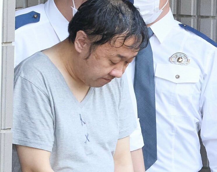 送検される高野容疑者（撮影/村上庄吾）