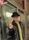 職質を終えて高円寺駅前交番で笑顔を浮かべる田代さん。その心中は複雑だった（田代さん公式Instagramより）