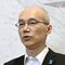 会見する野川明輝本部長(共同通信社)