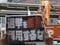 7月13日、成増駅前で演説するさや氏と参政党の公約に抗議するプラカード（撮影／集英社オンライン）
