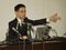 
1月15日、横浜市の山中竹春市長が銃撃する真似をした様子を再現する久保田淳人事部長（当時）（撮影／集英社オンライン）
