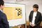 真剣な表情で一力４冠の講義を聞く中村さん。「７×７」での対局の結果は記事ラストの動画でチェック！