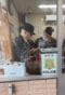 高円寺駅前交番内で“職質”に応じる田代さん（田代さん公式Instagramより）